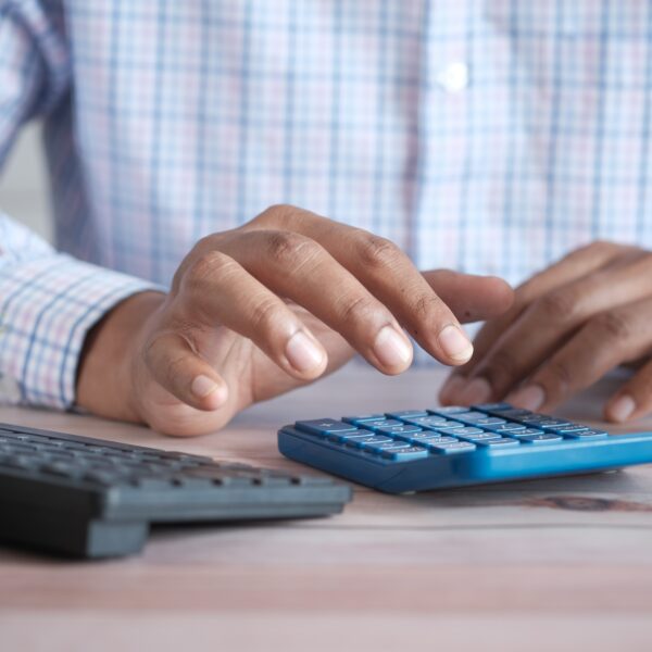 Person using a calculator on a desk