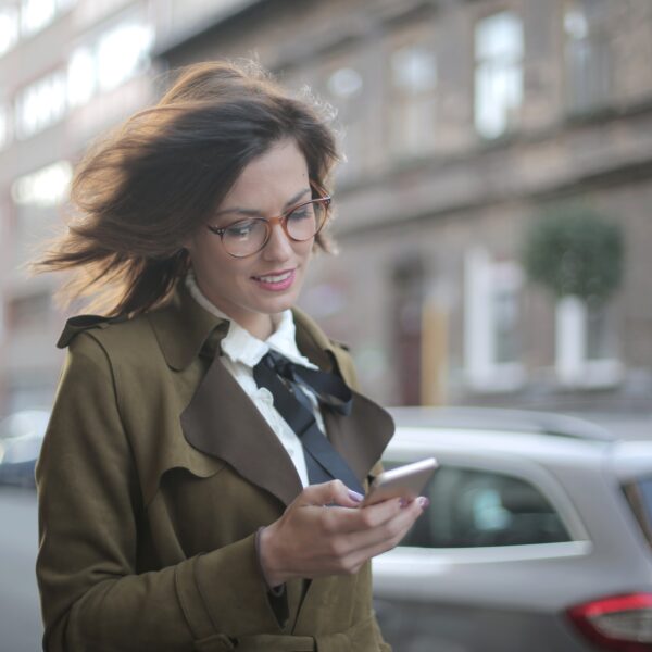 Woman using a smartphone whilst walking