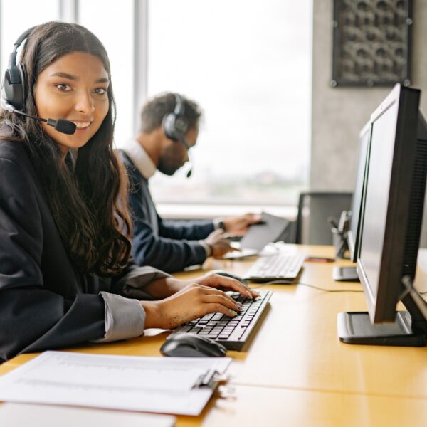 A smiling woman in a call center