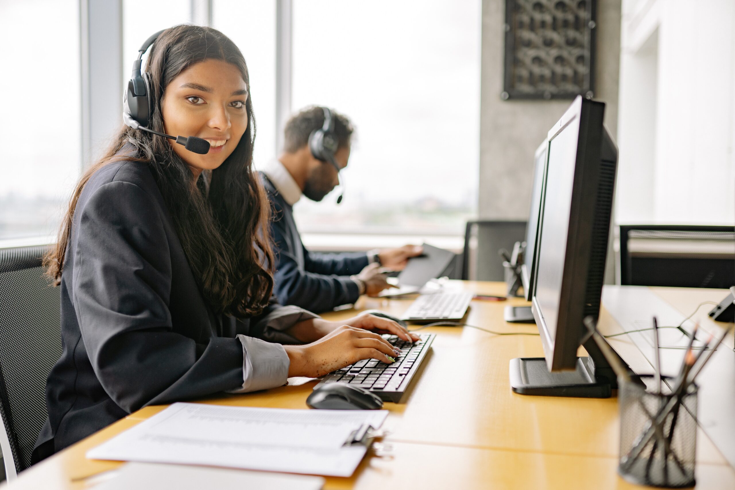 A smiling woman in a call center