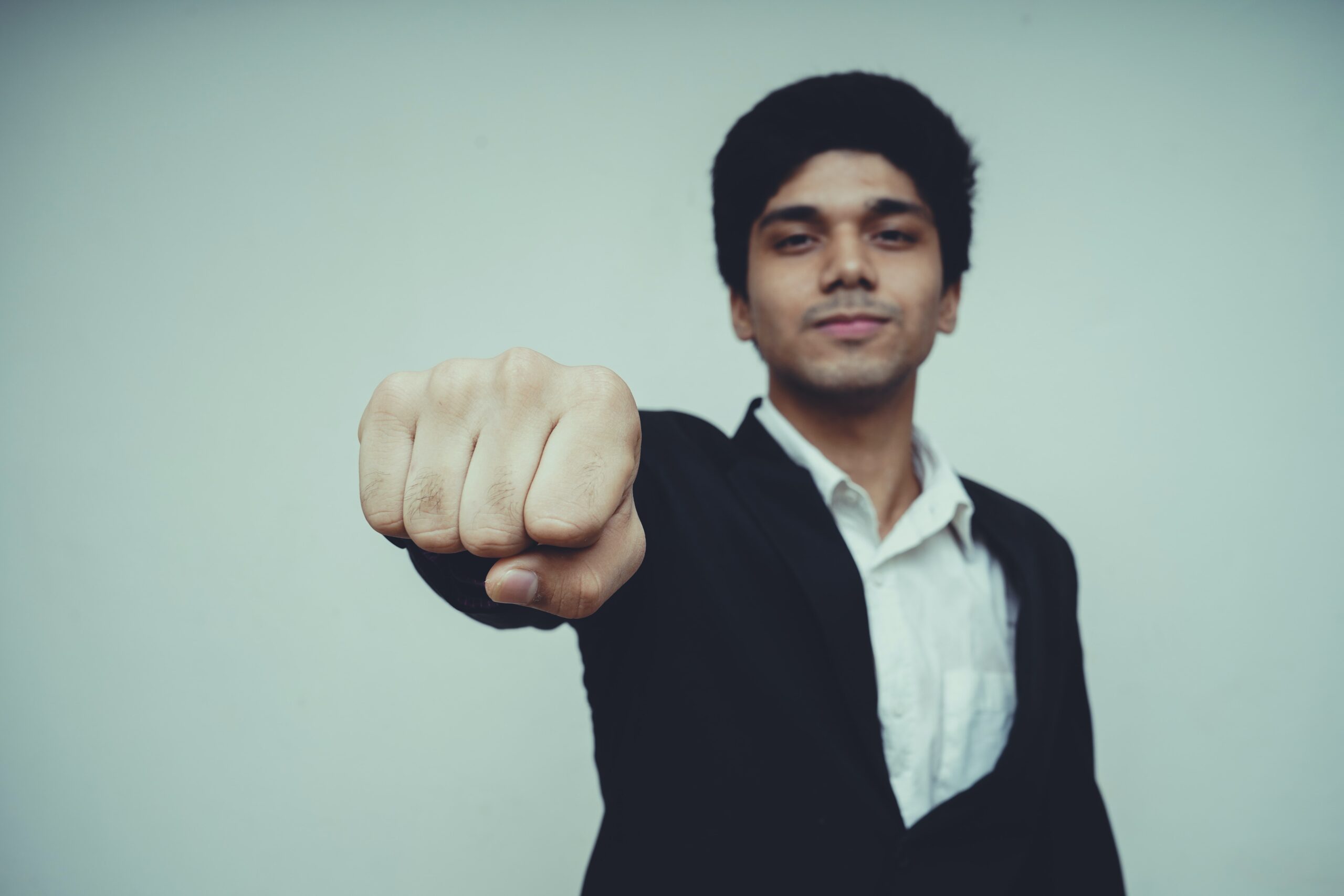 Man reaching out his hand for a fist bump