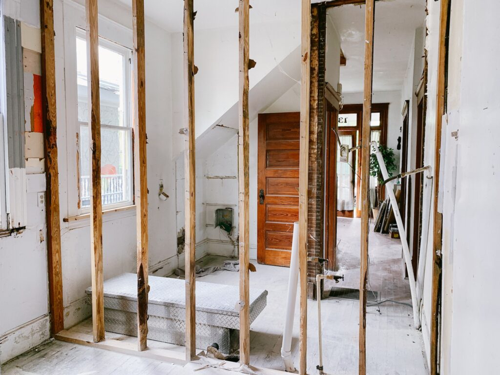 Wall being torn down in a house