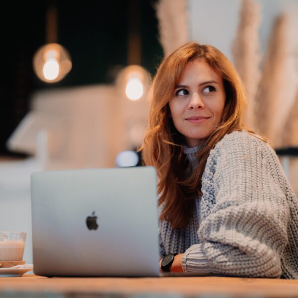 Woman sat behind a laptop