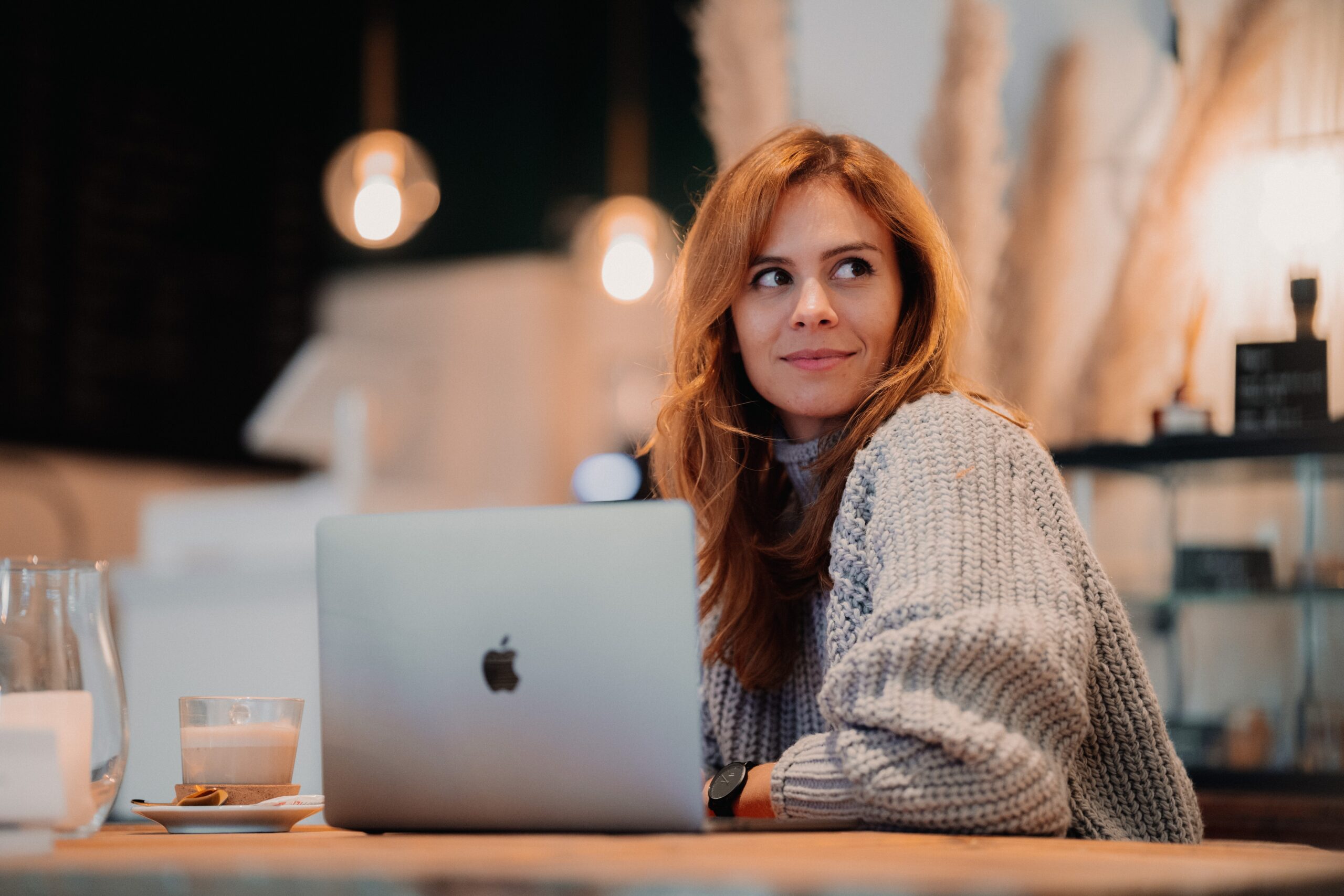 Woman sat behind a laptop
