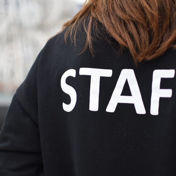 Woman wearing a Staff hoodie