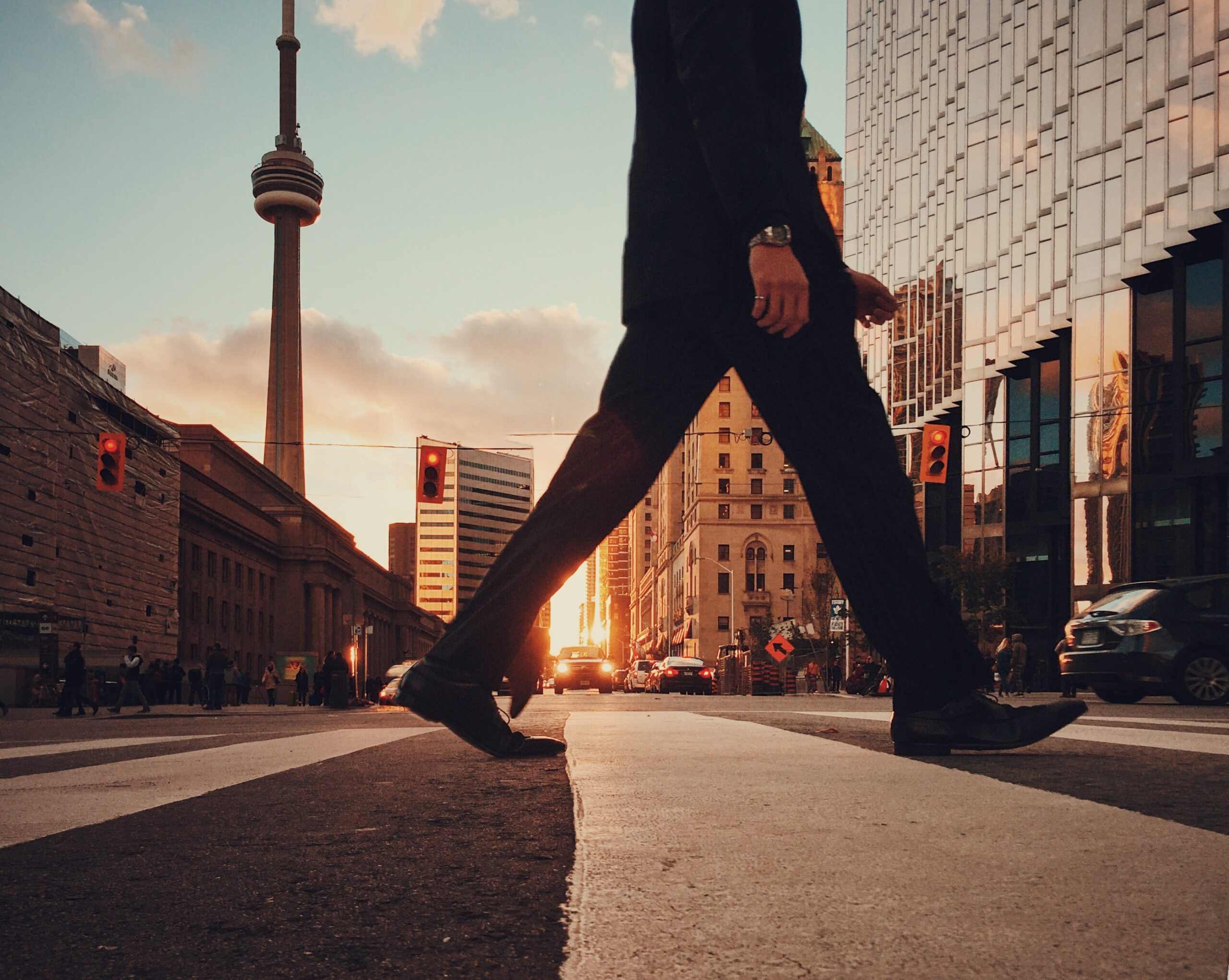 Person crossing the road in Financial District, Toronto, Ontario, Canada