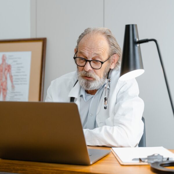 Doctor speaking to someone on a laptop