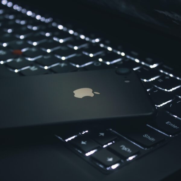 Black iPhone on a ThinkPad keyboard