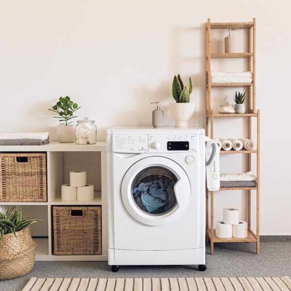 A washer/dryer in a laundry room