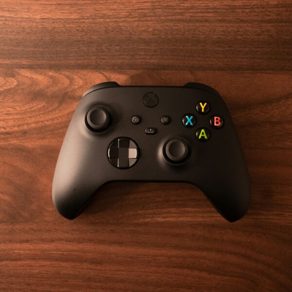 Black Xbox Series controller on a wooden table