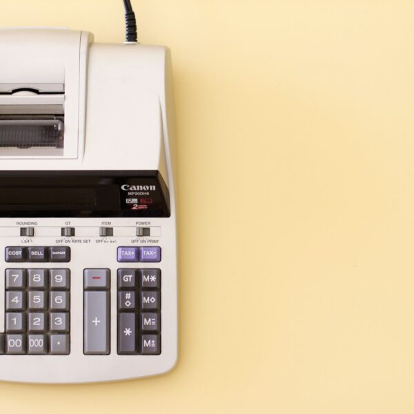 Canon MP20DH II accounting calculator on yellow desk